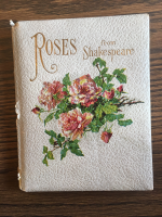red roses on white leathery cover with rose gold illustrations